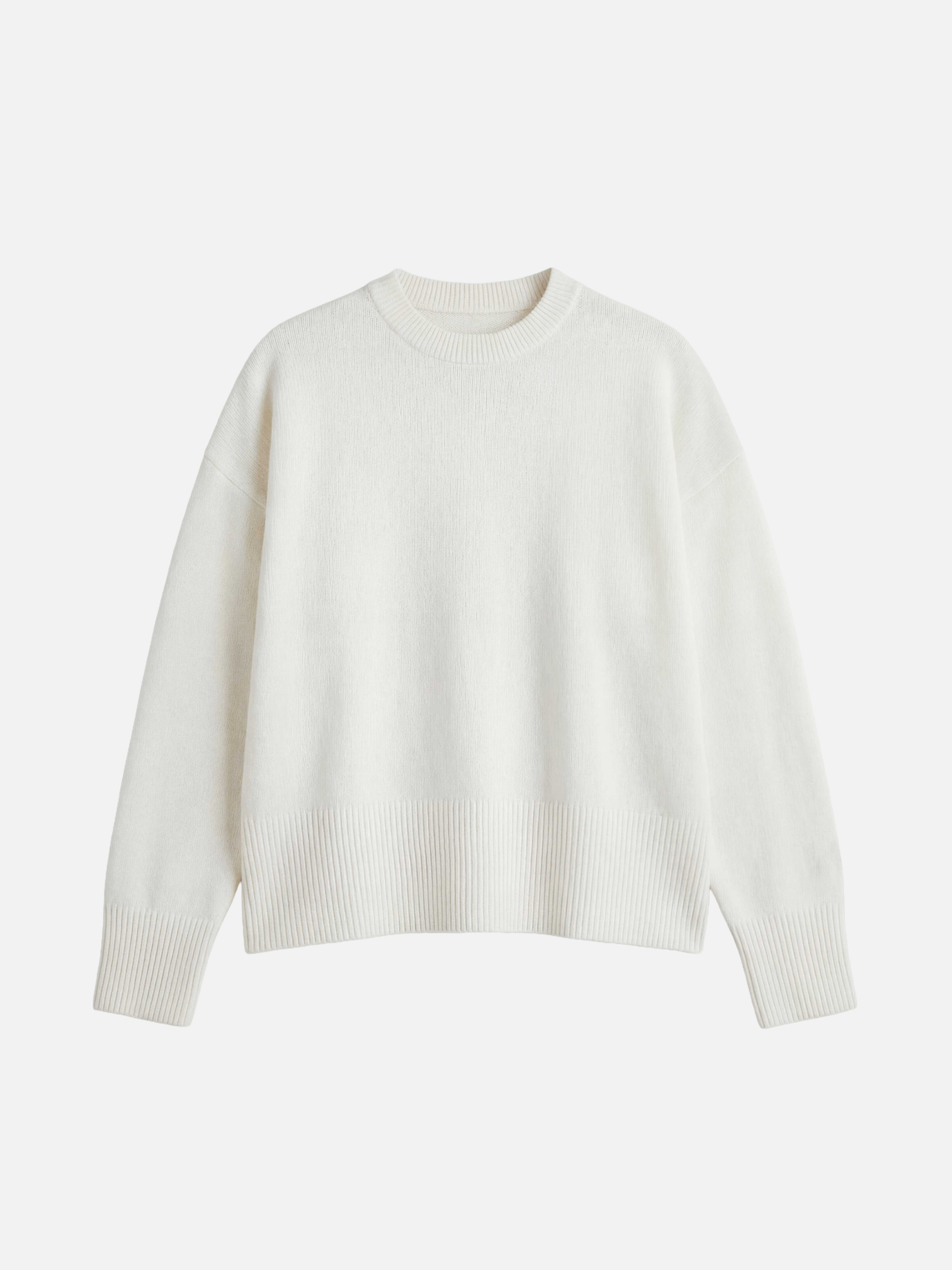 White sweater on a light beige background